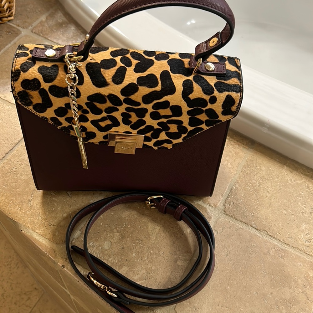 Excellent Condition: barely carried